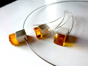 Cool, cubic necklace and earring set heats up with its spicy amber! Colianyc, Etsy; Necklace, $55, earrings, $70
